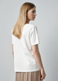 Kremowy T-shirt damski z rozcięciem